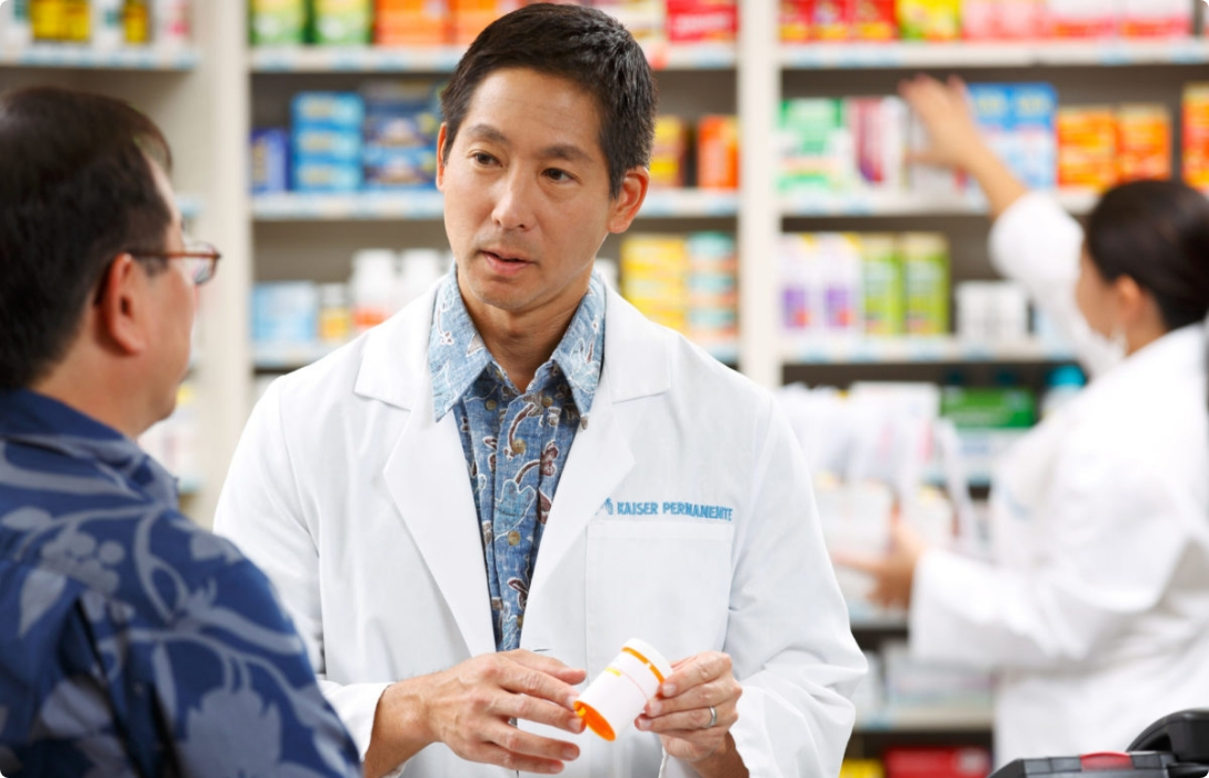 A pharmacist assisting a customer in a pharmacy shop, providing professional advice and medication expertise.