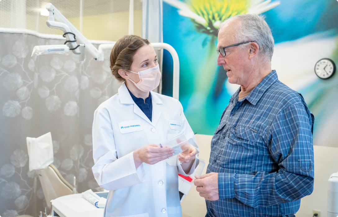 A dentist and patient in a dental office.